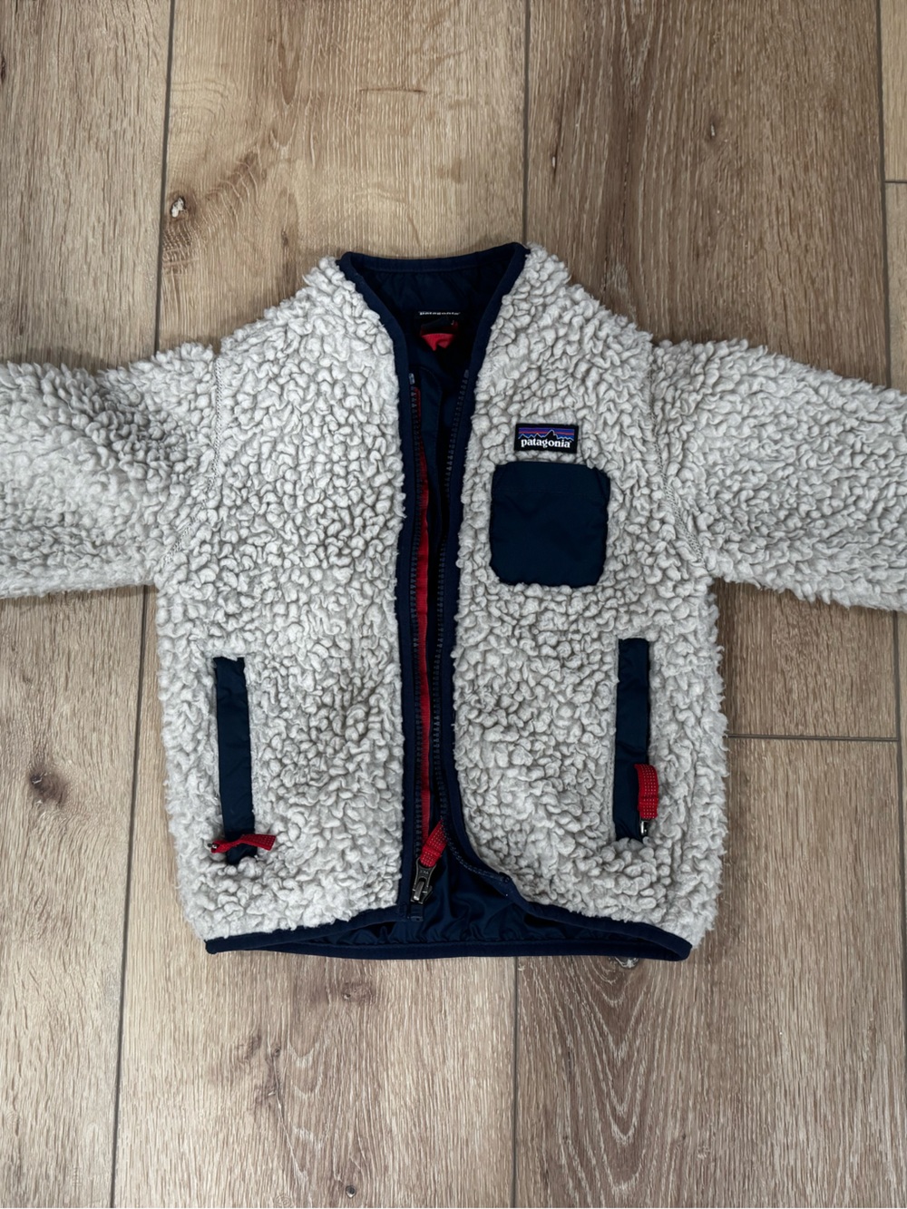 Patagonia Cream Sherpa Puffer Jacket with Navy Trim and Red Accents